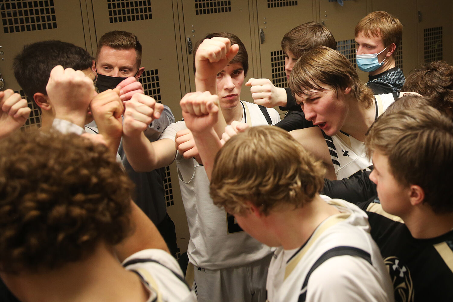 Hunter Stone leads the team in their huddle